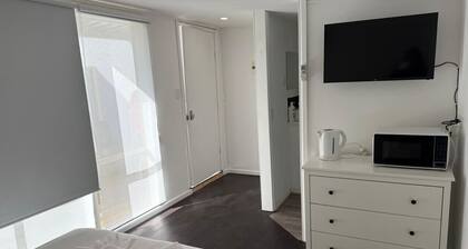 Cozy Budget Studio with AC and Private Bath