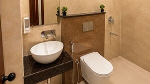 A modern bathroom with a large sink, toilet, and shower. - Ram Sadan Ayodhya (Ayodhya)