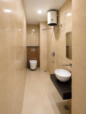 A modern bathroom with a large white sink, a toilet, and a shower. - Ram Sadan Ayodhya (Ayodhya)