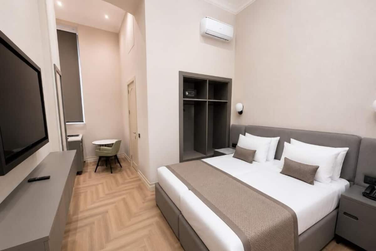 Superior Double or Twin Room, Courtyard View | Minibar, desk, laptop workspace, blackout drapes