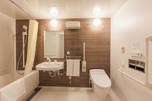 Uma casa de banho moderna com banheira, lavatório, sanita e chuveiro.
