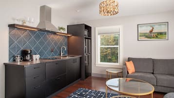 Luxe suite, uitzicht op zee | Woonruimte