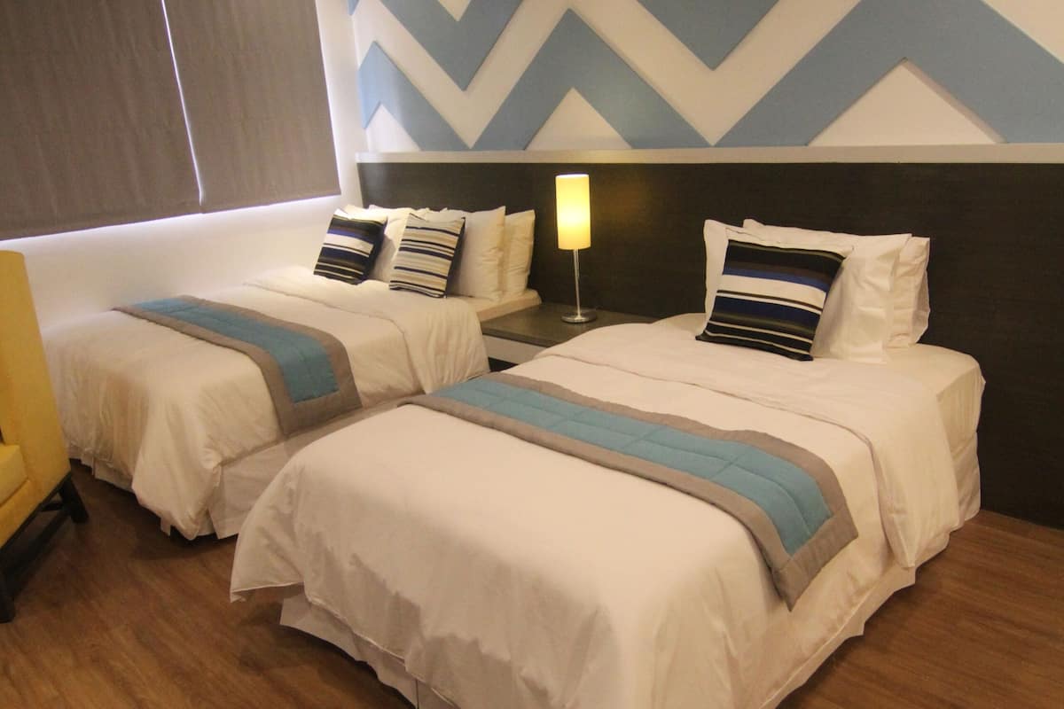 Deluxe Triple Room, City View | Desk, laptop workspace, free WiFi