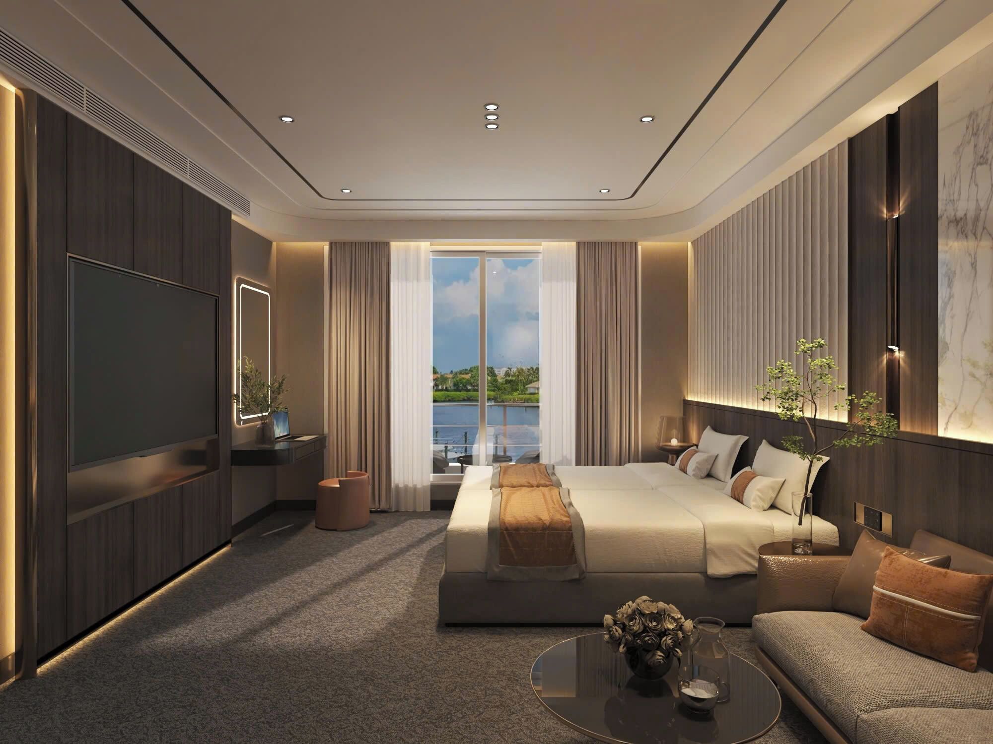 Una habitación de hotel moderna con una cama grande, un sofá, un televisor y vistas al exterior.