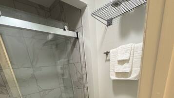Shower, hair dryer, towels, soap