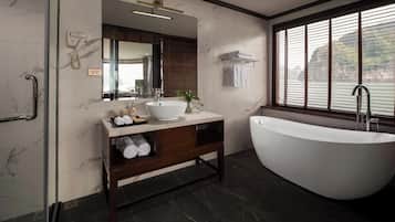 Separate bathtub and shower, hair dryer, slippers, towels