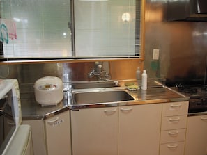 Fridge, microwave, stovetop, cookware/dishes/utensils