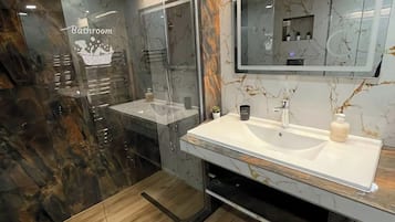 Shower, hair dryer, towels, soap