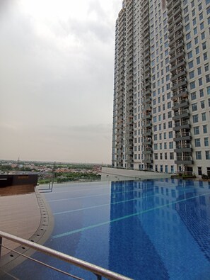 Outdoor pool, open 6:00 AM to 9:00 PM, lifeguards on site - BIMA HOTEL (Surabaya)