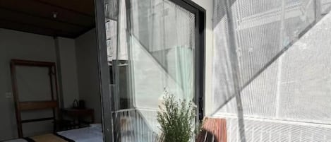 Deluxe Double Room, Balcony, City View | Blackout drapes, iron/ironing board