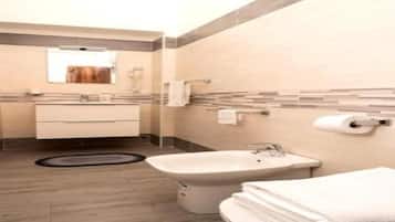 Hair dryer, bidet, towels, toilet paper