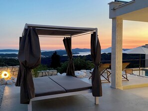 A covered outdoor seating area with a view of the landscape. - Čiovo Hills - Villa in Trogir with pool & stunning sea view (Žedno)