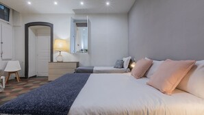 A bedroom with a bed, bedside tables, a lamp, a mirror, and a door. - Conte Verde - Bilo 7 Grey by Wonderful Italy (Turin)