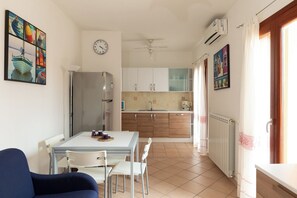 Apartment, 1 Bedroom, Balcony | Living area - Sa Pintadera by Wonderful Italy (Olbia)