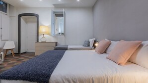 A bedroom with a bed, bedside tables, a lamp, a mirror, and a wardrobe. - Conte Verde - Bilo 7 Grey by Wonderful Italy (Turin)
