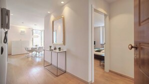 A modern interior with a dining area, a mirror, and a bed. - Stunning Apartment a/c 6P With Sea View - Cannes (Cannes)