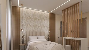 Una camera da letto moderna con un letto, comodini, un armadio e una parete decorativa.