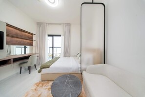 Desk, iron/ironing board, WiFi, bed sheets - Modern Studio Near Metro | Pool, Gym & Expo Access (Dubai)