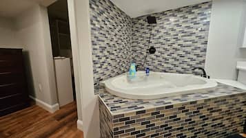 Shower, jetted tub, hair dryer, towels