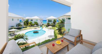 Oceans 8: Oceanside Lazy River Pool, Sunken BBQ Lounge + Designer Interiors in West Bay