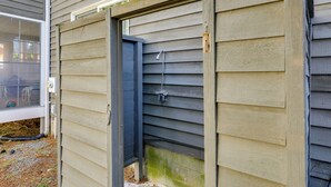A house exterior with siding, a window, and a door. - Easy Beach Access! Bethany Retreat on Trolley Loop (Bethany Beach)