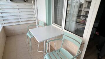Classic Triple Room, Balcony | Outdoor dining