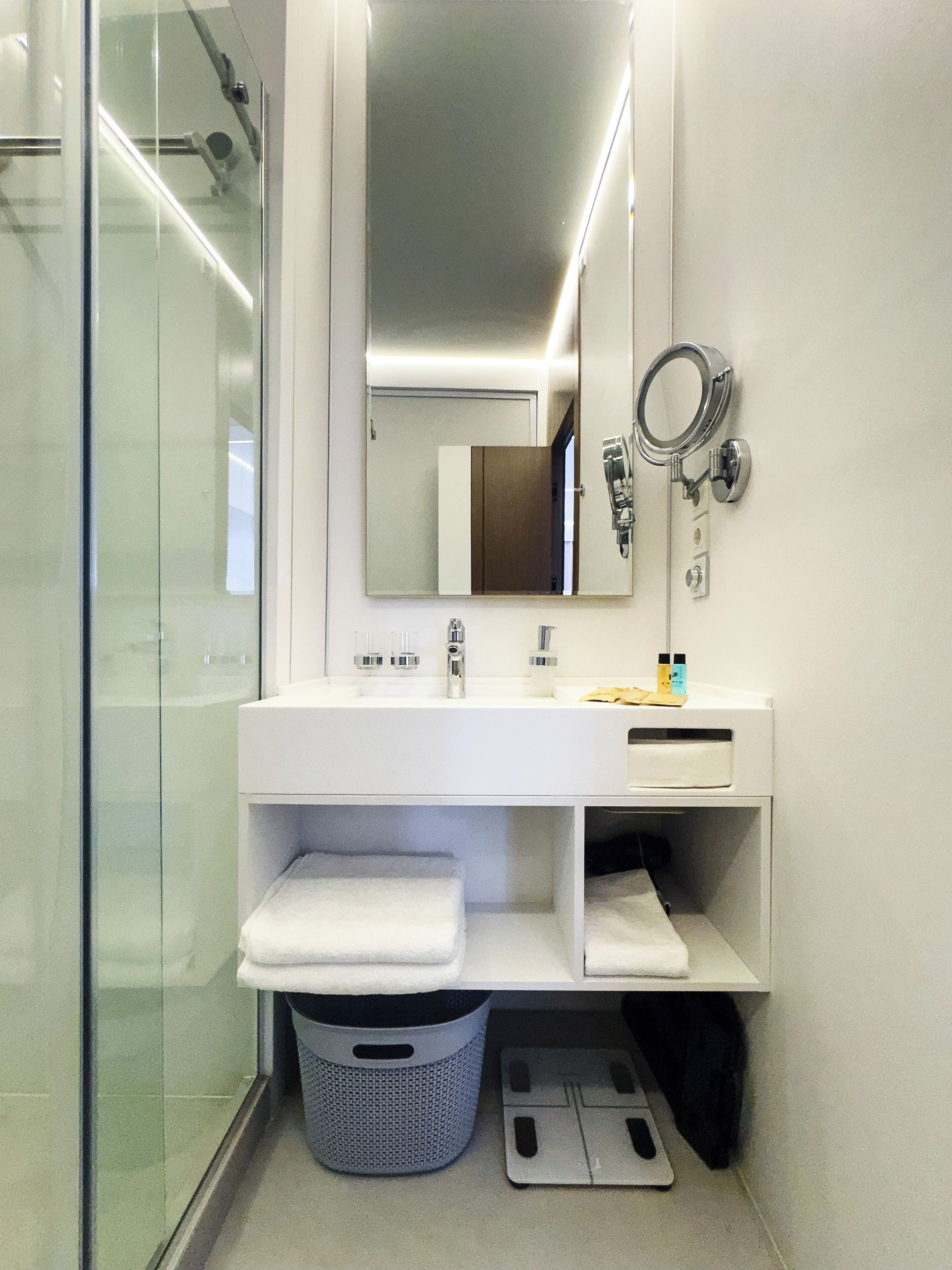 Shower, hair dryer, slippers, towels