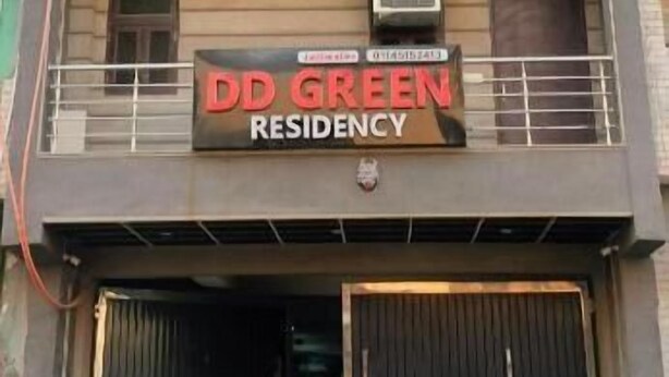 A multi-story building with a sign reading 'DD GREEN RESIDENCY.' - DD Green Residency (New Delhi)
