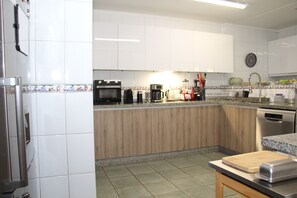 Fridge, microwave, oven, cookware/dishes/utensils