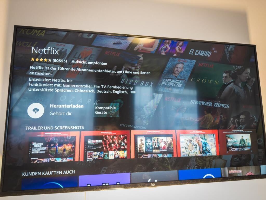 A television displaying Netflix content with various movie thumbnails.