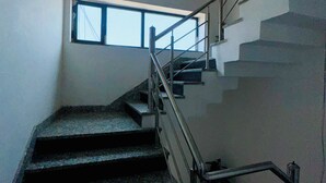 A staircase with metal railings and a window at the top. - Hotel Radha Ratan Inn (Jaipur)