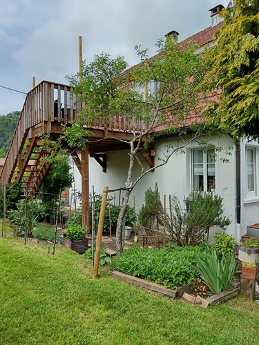 In a house with garden, apartment with terrace near a lake.