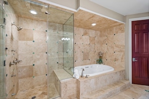A bathroom with a glass-enclosed shower, a freestanding bathtub, and a door. - Avalon Penthouse 4 - Top of the Tower Luxury! Beach Club - 5/5 Double Mstr (Gulf Shores)