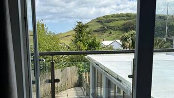 Standard Double Room, Balcony, Partial Sea View | Laptop workspace, iron/ironing board, free WiFi, bed sheets