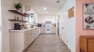 Stovetop, lobster pot, paper towels, dining table