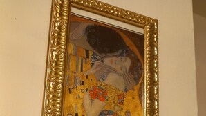 A framed artwork with a textured gold border. - Large master bedroom with private bathroom (Friuli-Venezia Giulia)