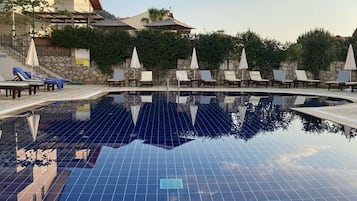Seasonal outdoor pool, pool umbrellas, pool loungers