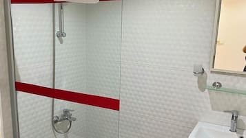 Shower, towels, soap, toilet paper