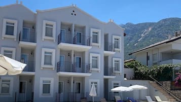 Seasonal outdoor pool, pool umbrellas, sun loungers