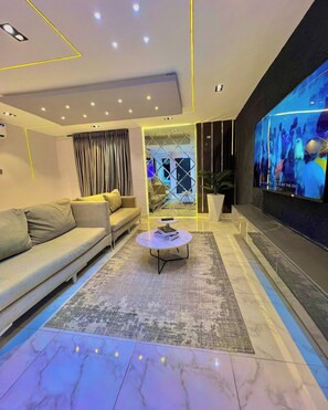 Economy Apartment, Balcony, City View | Living area - Attention By Ndifon (Abuja)