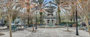 A courtyard with a gazebo, benches, and a fountain. - Stylish 2BR Retreat Near Midtown Tampa (Westchase)