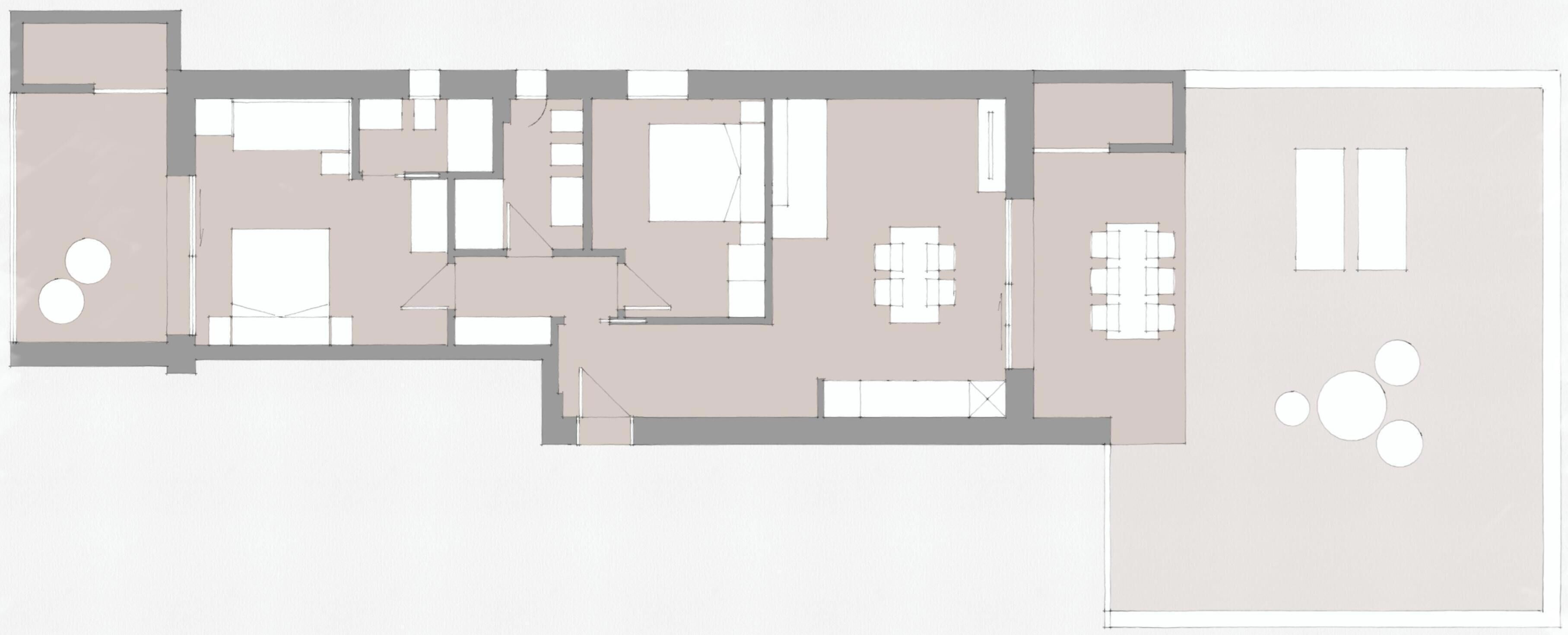 Ein Grundriss mit mehreren Räumen, darunter eine Essecke mit Tischen und Stühlen, eine Küche und einige Schlafzimmer.