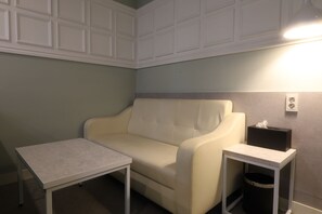Quarto casal premium | Área de estar