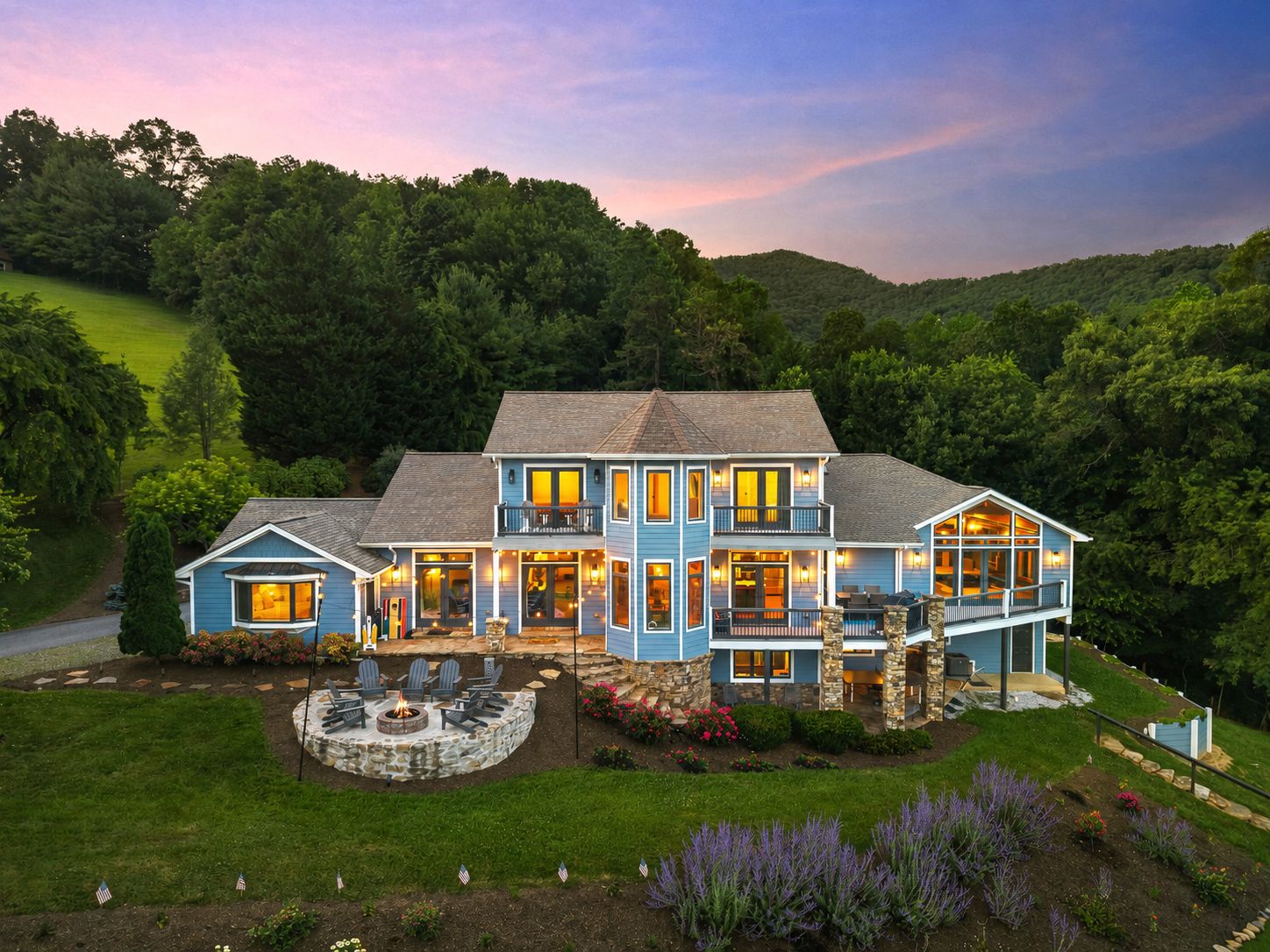 Welcome to Blue Mountain View, a private mountain retreat surrounded by breathtaking scenery. Enjoy unforgettable sunsets, gathering spaces, a private indoor swim spa, sauna, game room, gym, firepit, and plenty of room to reconnect with friends.