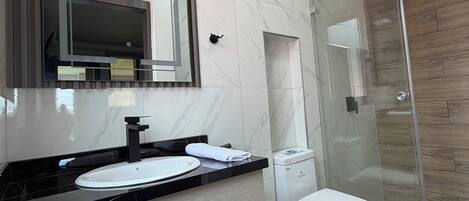 Shower, hair dryer, towels, soap