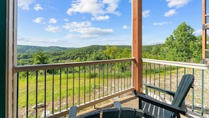 A balcony with a view of a forested landscape. - The Golden Hour Great Views (Branson)