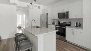 Fridge, dining tables - Landing | Stylish 2BD, Clubhouse (Austin)