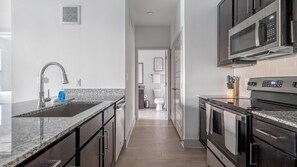 Fridge, dining tables - Landing | Chic 1BD, Pool, Gym (Austin)