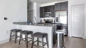 Fridge, dining tables - Landing | Chic 1BD, Gym, Pool (Austin)