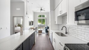 Fridge, dining tables - Landing | Chic 1BD, Courtyard, Gym (Nashville)